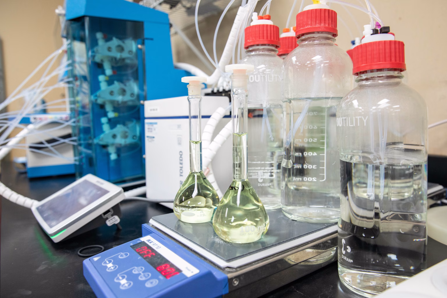 Flasks in CMC laboratory with analytical and formulation equipment